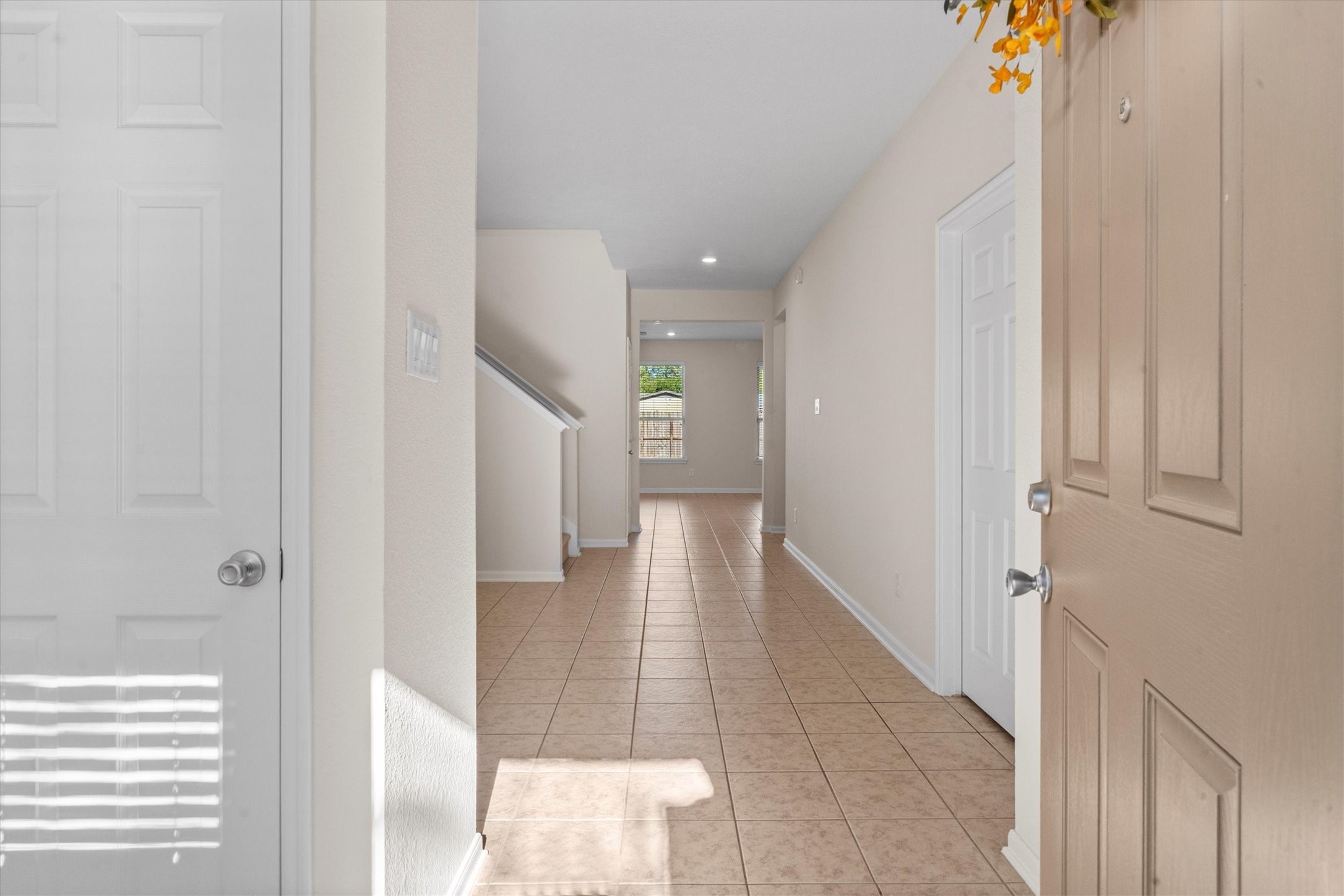 4022 Streambed Trail Houston, TX 77068 - Photo 10 of 32 a view of a hallway with wooden floor and staircase
