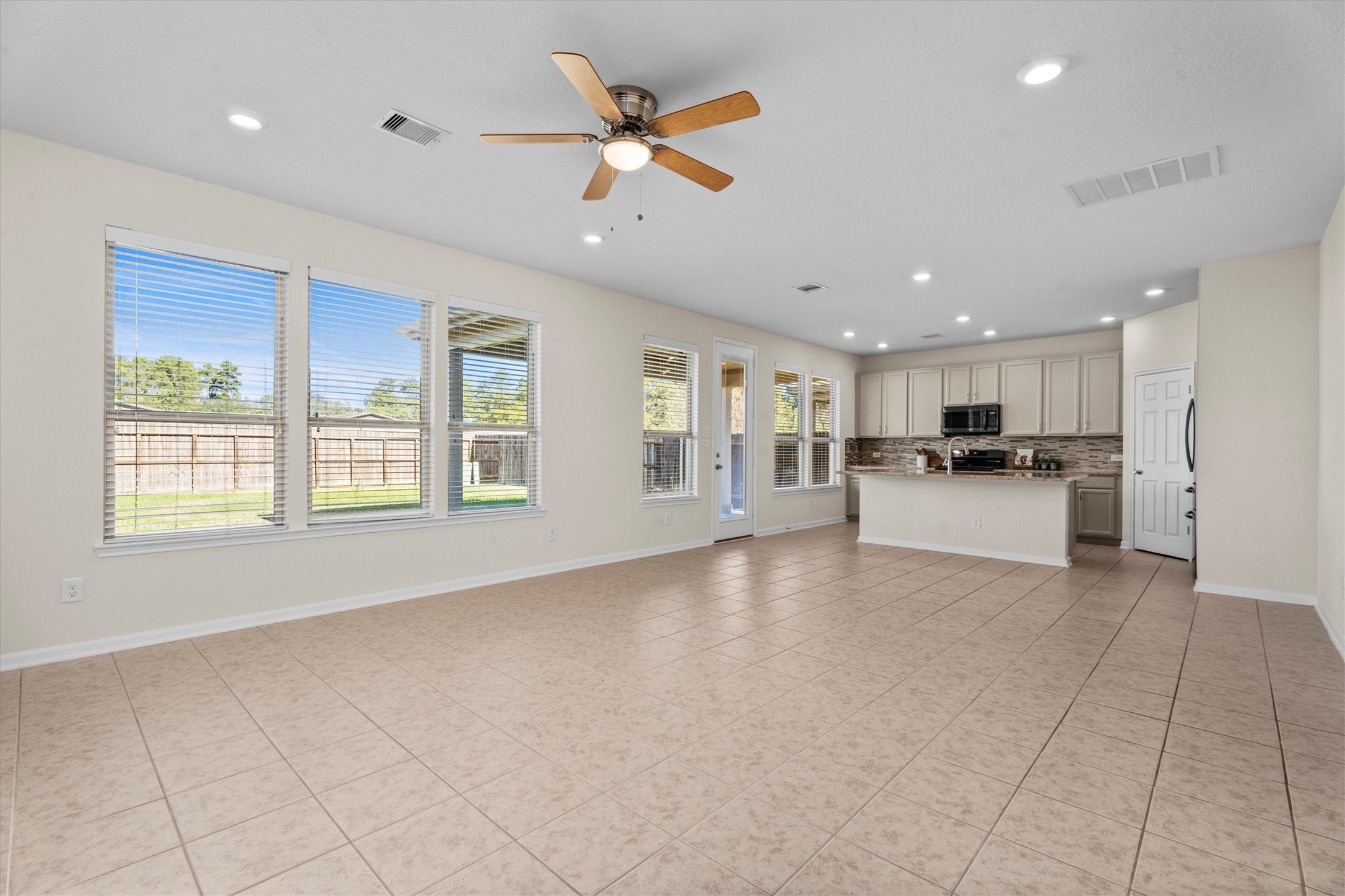4022 Streambed Trail Houston, TX 77068 - Photo 32 of 32 a view of an empty room with kitchen appliances and a window