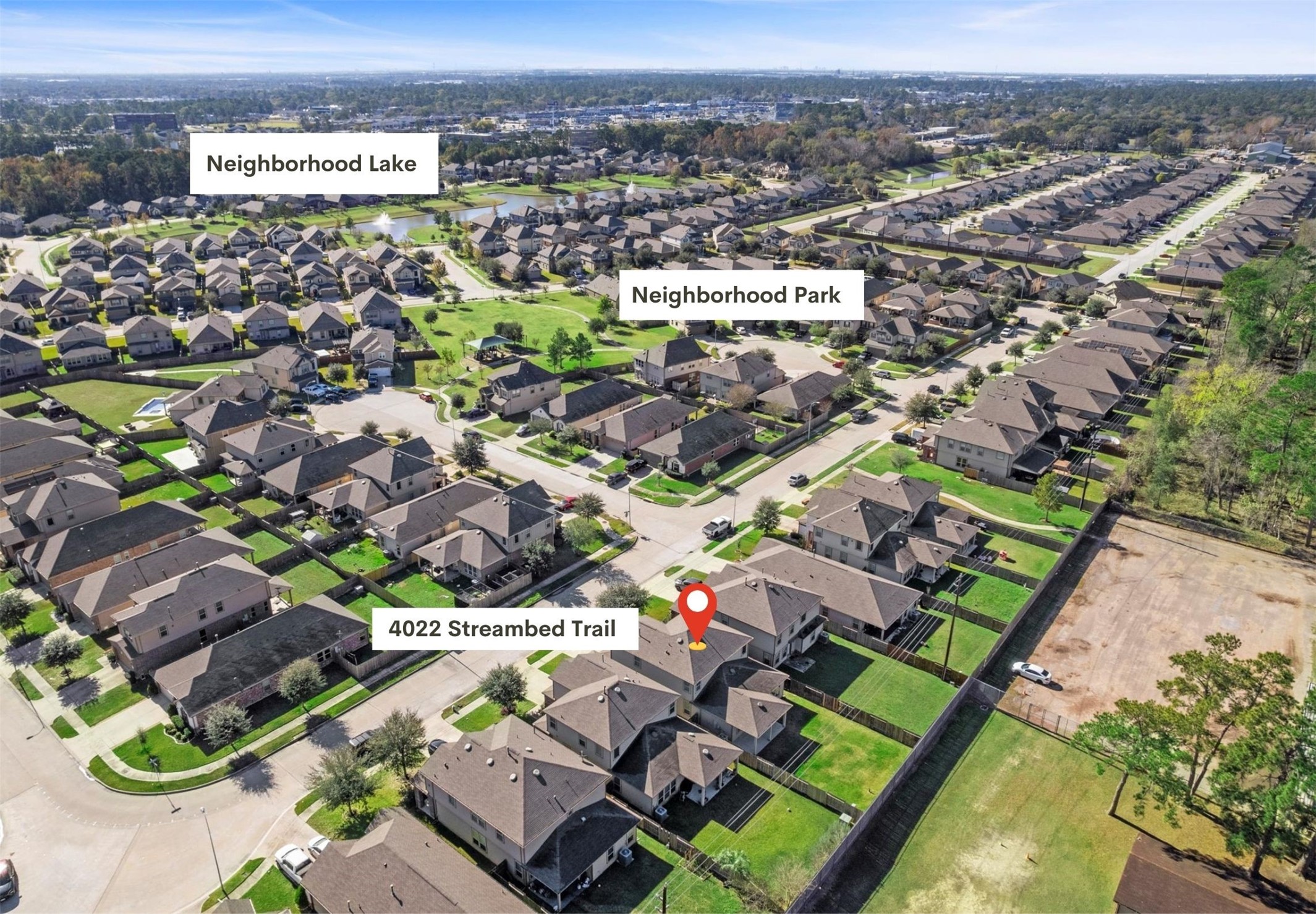an aerial view of residential houses with outdoor space