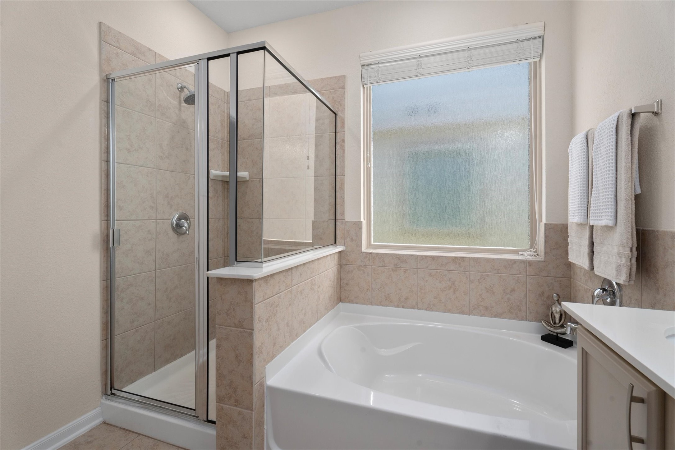 4022 Streambed Trail Houston, TX 77068 - Photo 19 of 32 a white bath tub sitting next to a bathroom sink