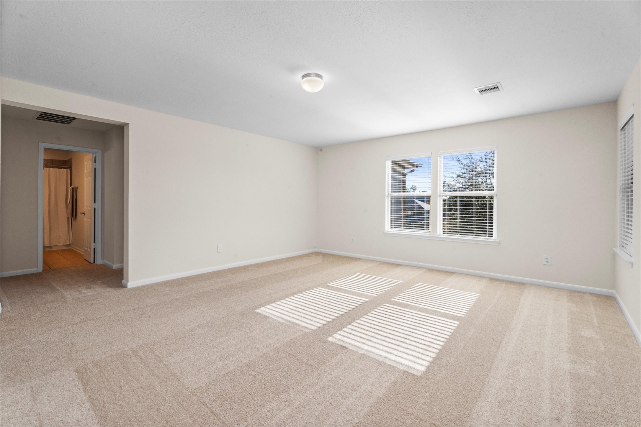 4022 Streambed Trail Houston, TX 77068 - Photo 22 of 32 a view of an empty room with a window