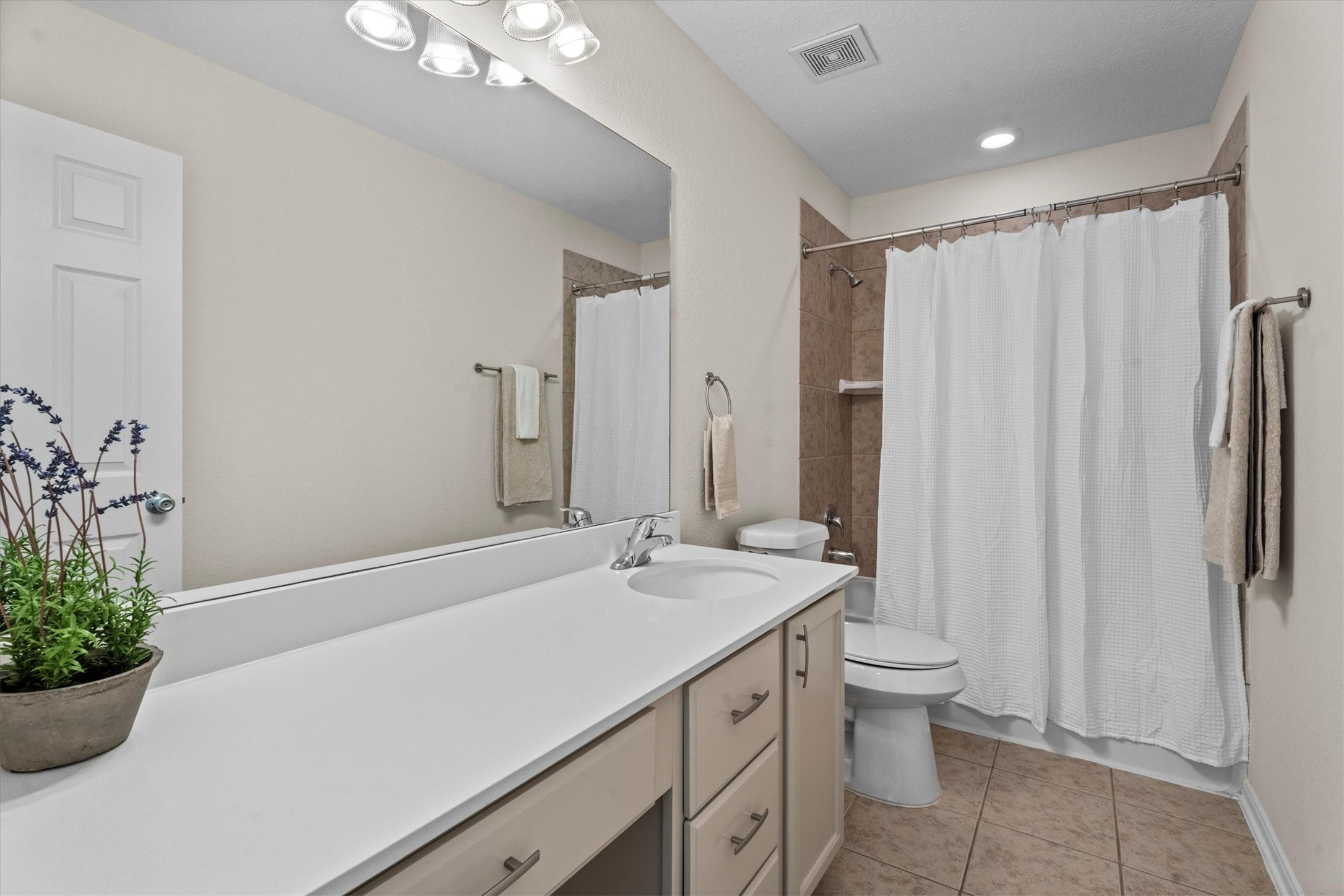 4022 Streambed Trail Houston, TX 77068 - Photo 24 of 32 a bathroom with a sink a toilet and a mirror