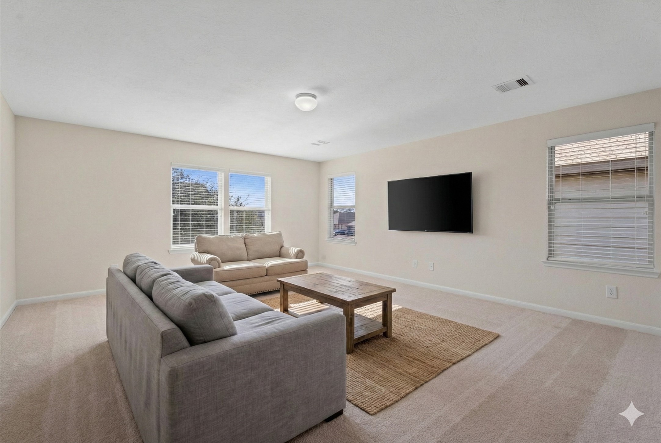 4022 Streambed Trail Houston, TX 77068 - Photo 4 of 32 a living room with furniture and a flat screen tv
