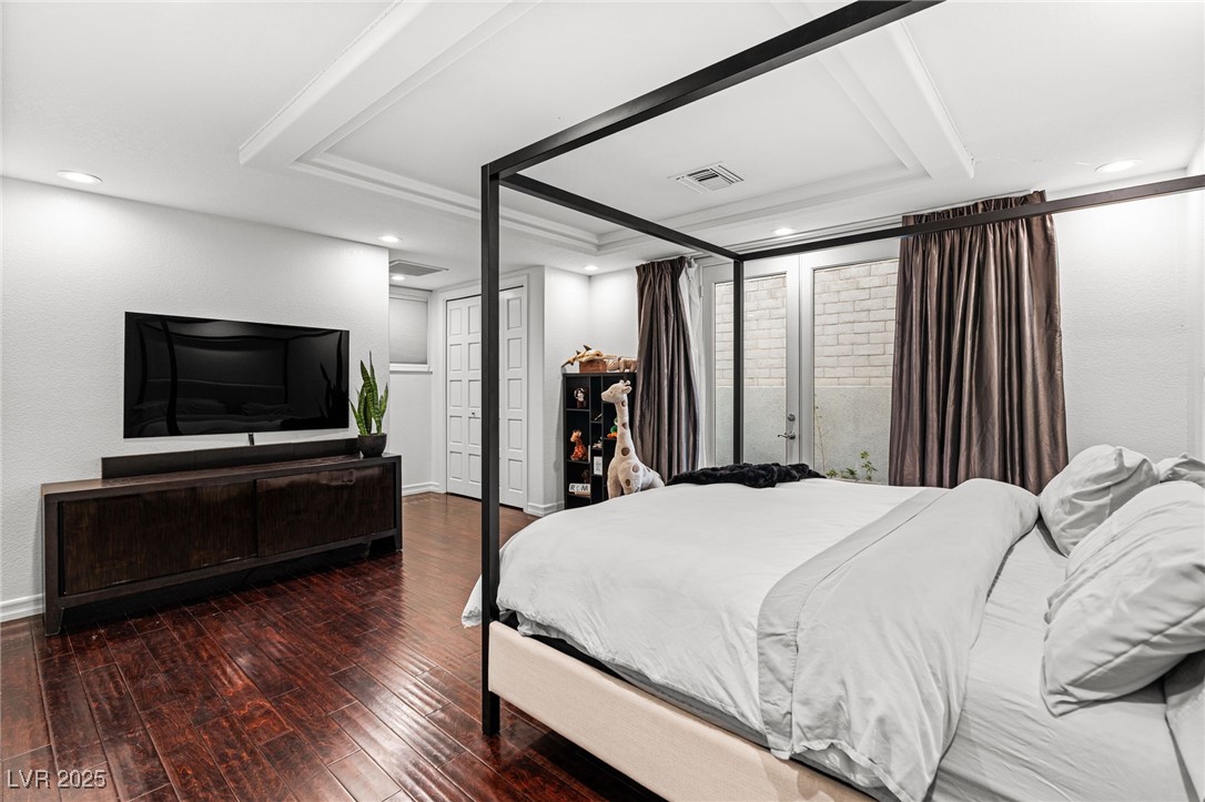 2057 Troon Drive Henderson, NV 89074 - Photo 26 of 41 Bedroom with a tray ceiling, dark wood finished floors, and recessed lighting