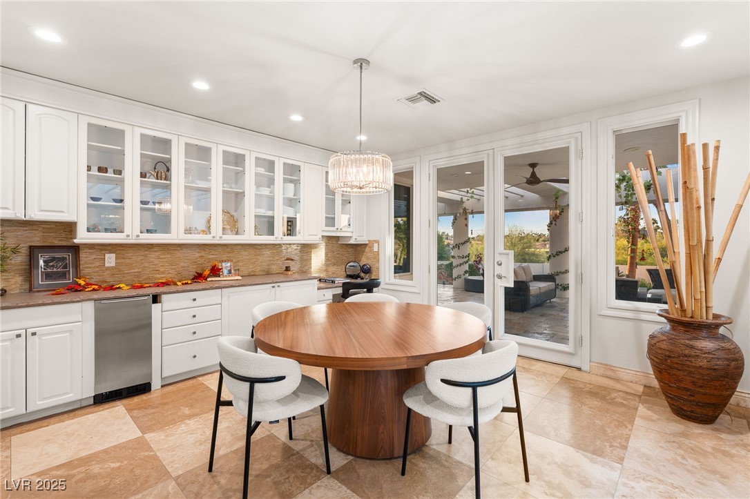2057 Troon Drive Henderson, NV 89074 - Photo 31 of 41 Dining space with recessed lighting, french doors, and a chandelier