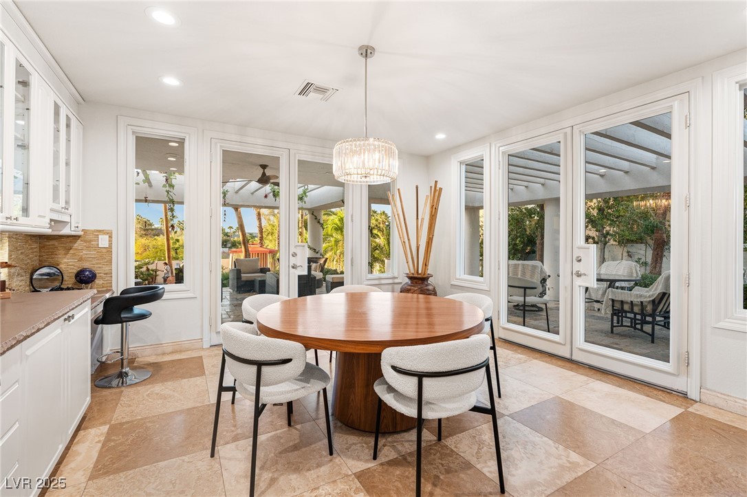 2057 Troon Drive Henderson, NV 89074 - Photo 32 of 41 Dining area featuring plenty of natural light, a chandelier, recessed lighting, and ceiling fan