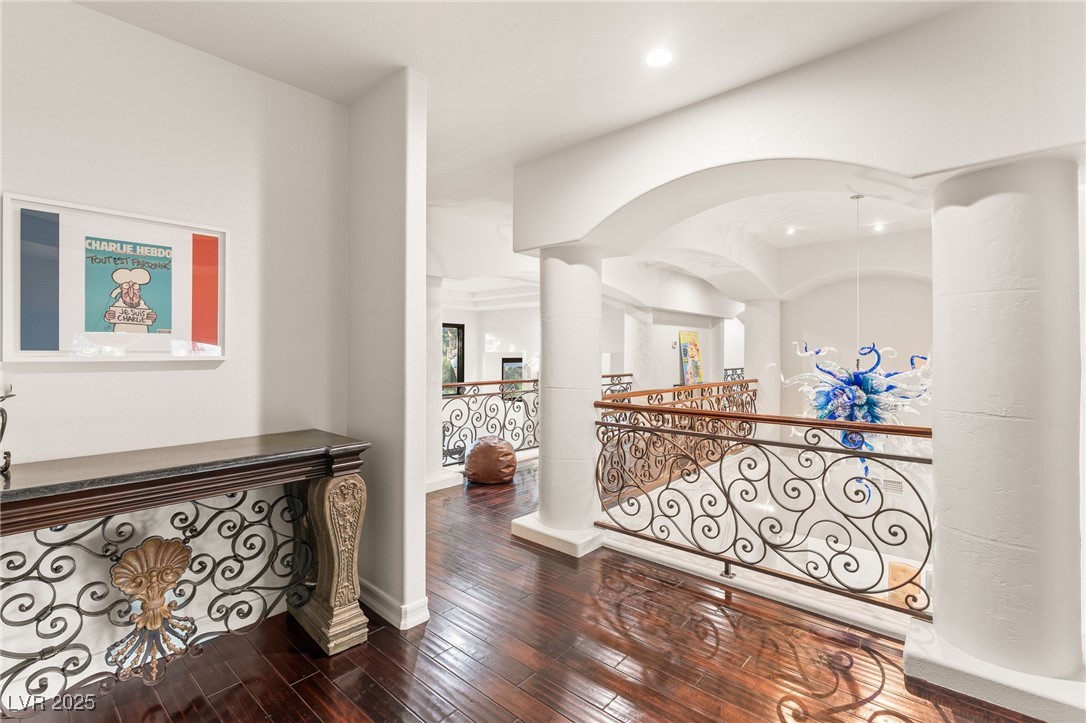 2057 Troon Drive Henderson, NV 89074 - Photo 33 of 41 Hallway with dark wood finished floors and an upstairs landing