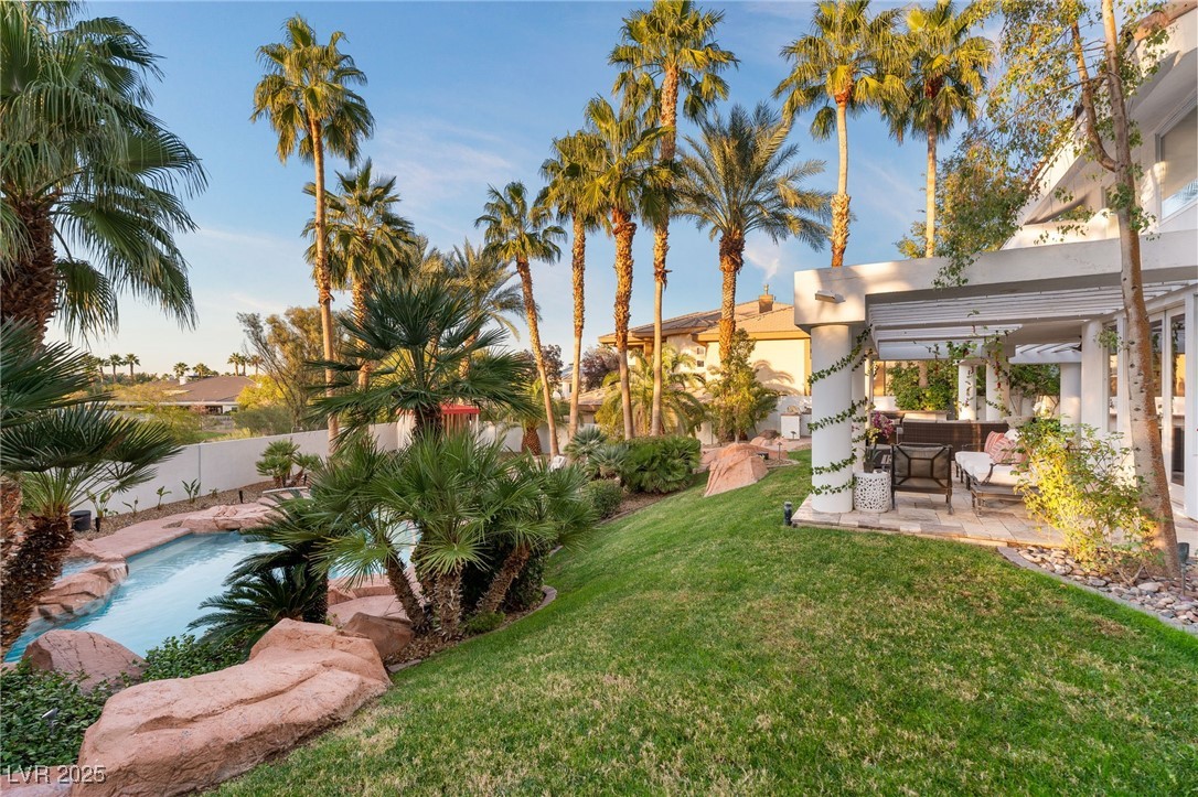 2057 Troon Drive Henderson, NV 89074 - Photo 37 of 41 Fenced backyard featuring a pergola, a patio, and an outdoor hangout area