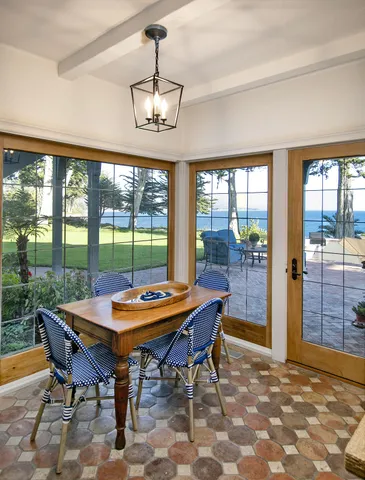 a view of a dining room with furniture window and outside view