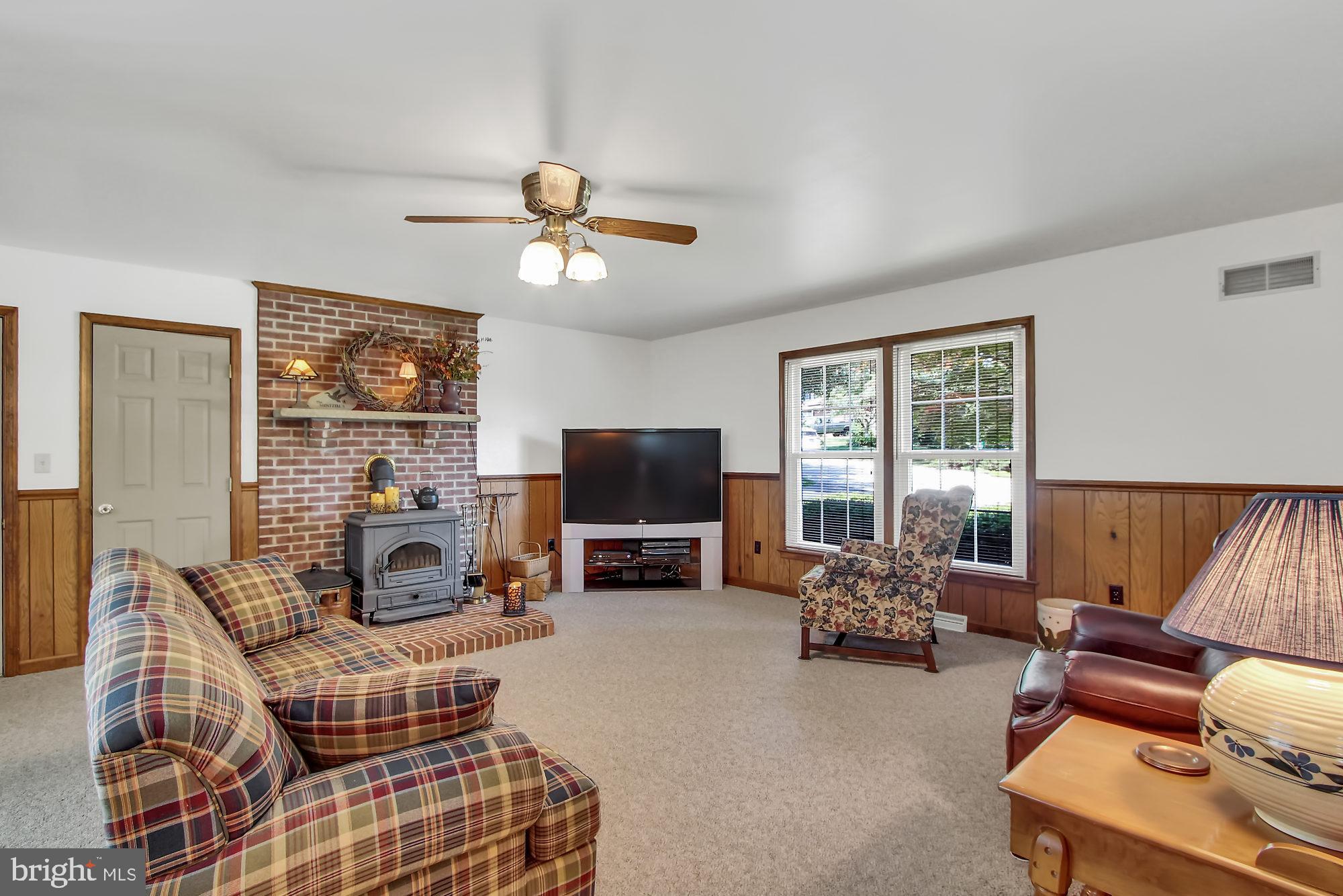 28 Stone Ridge Drive New Freedom, PA 17349 - Photo 6 of 26 Family Room with wood burning stove
