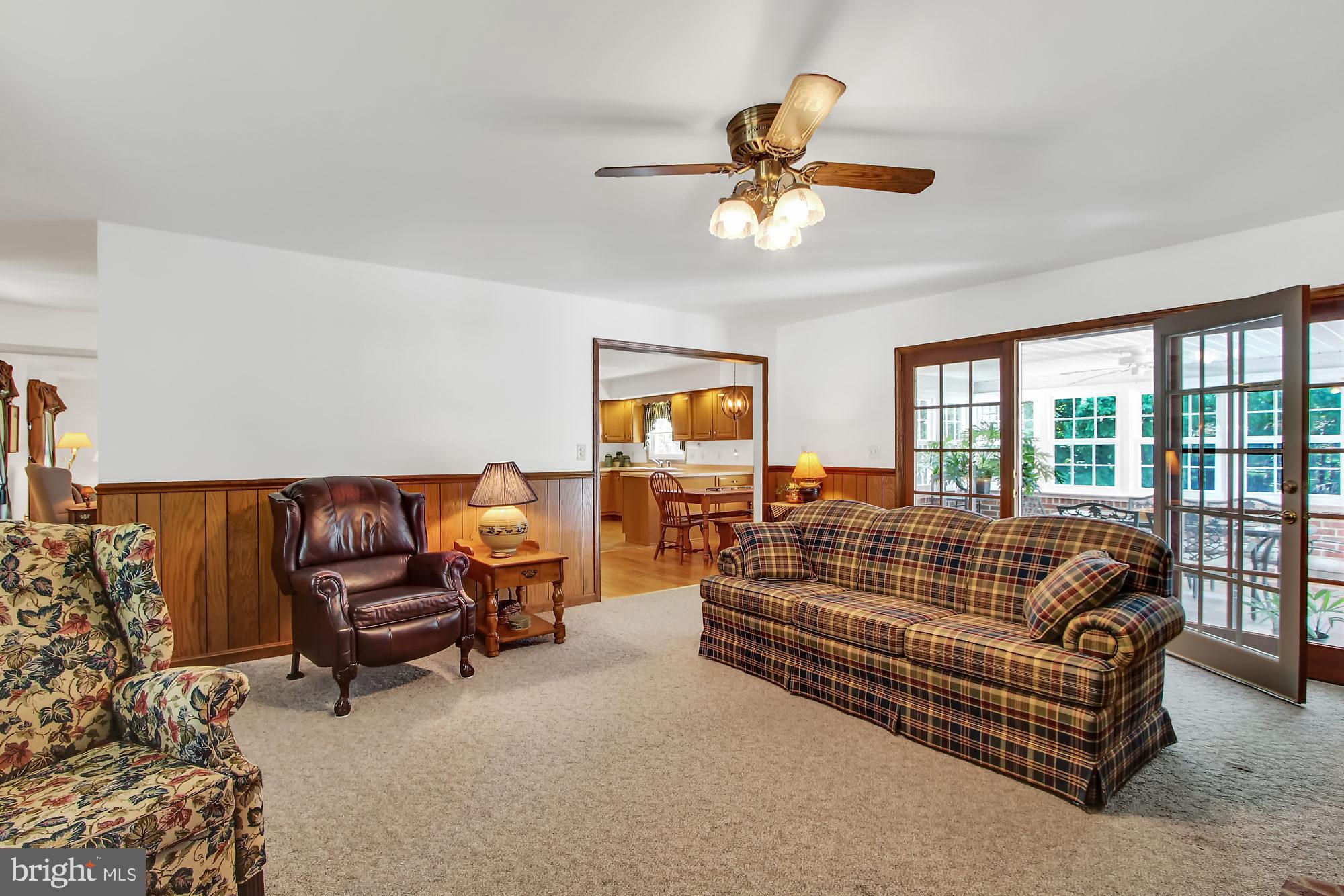 28 Stone Ridge Drive New Freedom, PA 17349 - Photo 7 of 26 Family Room leading to all season room