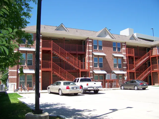 a front view of a building with street view