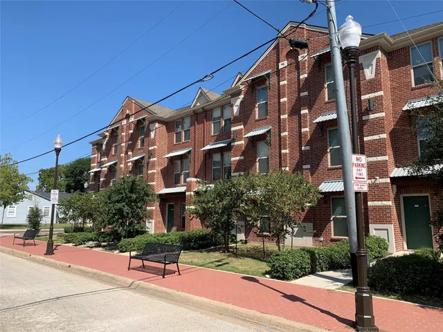 a building exterior with stairs and windows