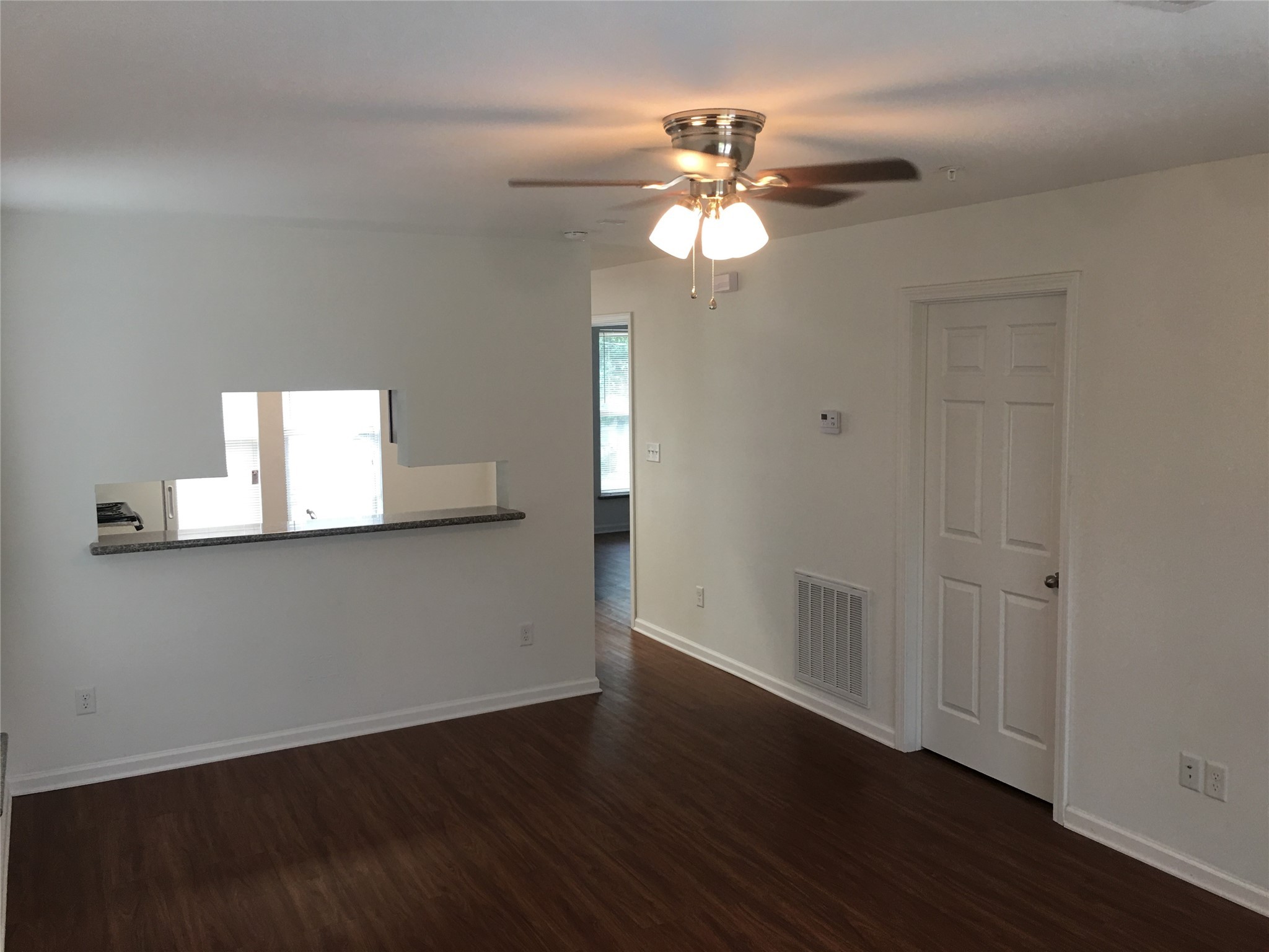 300 Spruce Street College Station, TX 77840 - Photo 8 of 16 a view of an empty room with wooden floor and a window