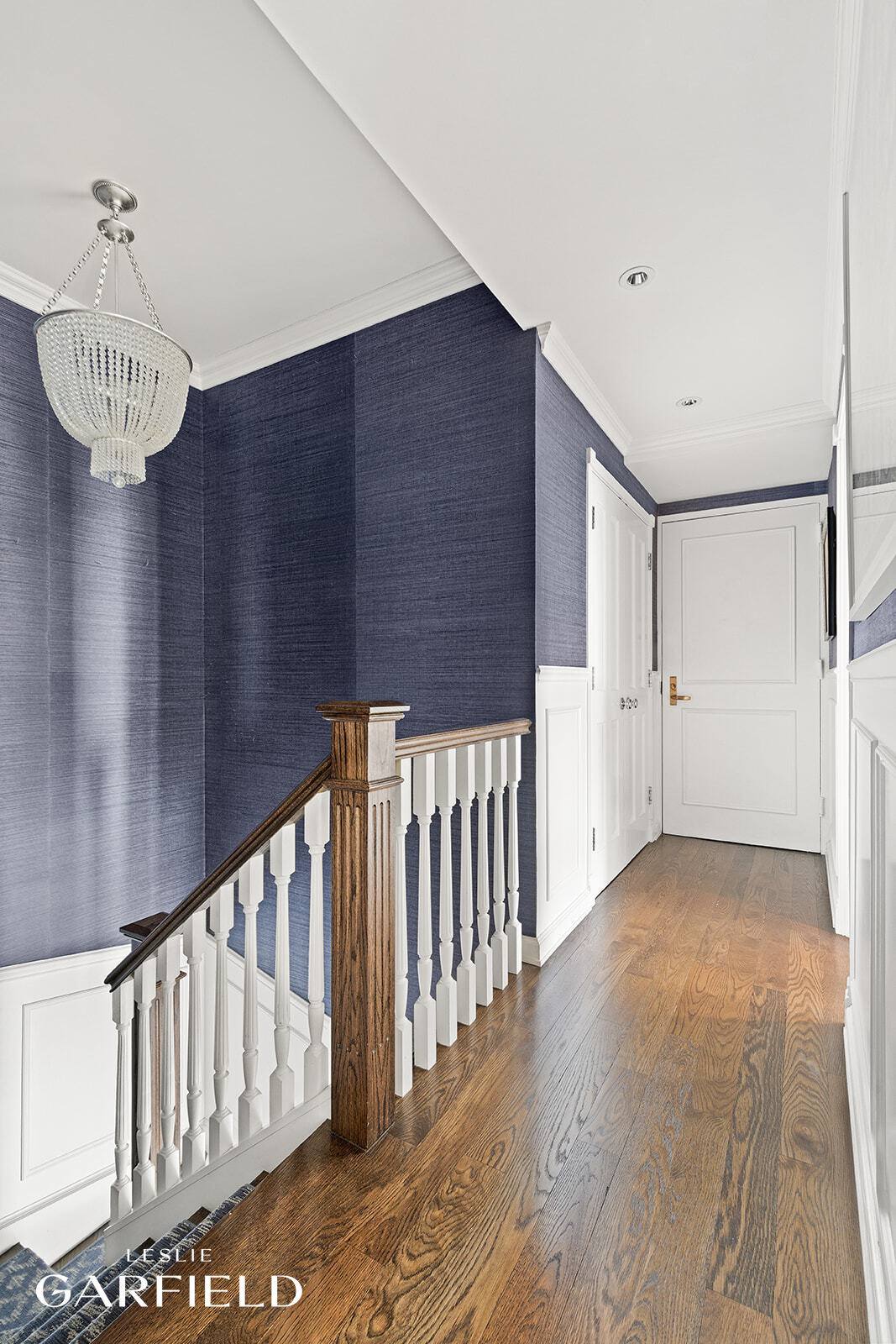 400 East 70th Street, Unit 3602 Manhattan, NY 10021 - Photo 13 of 21 a view of a hallway with wooden floor