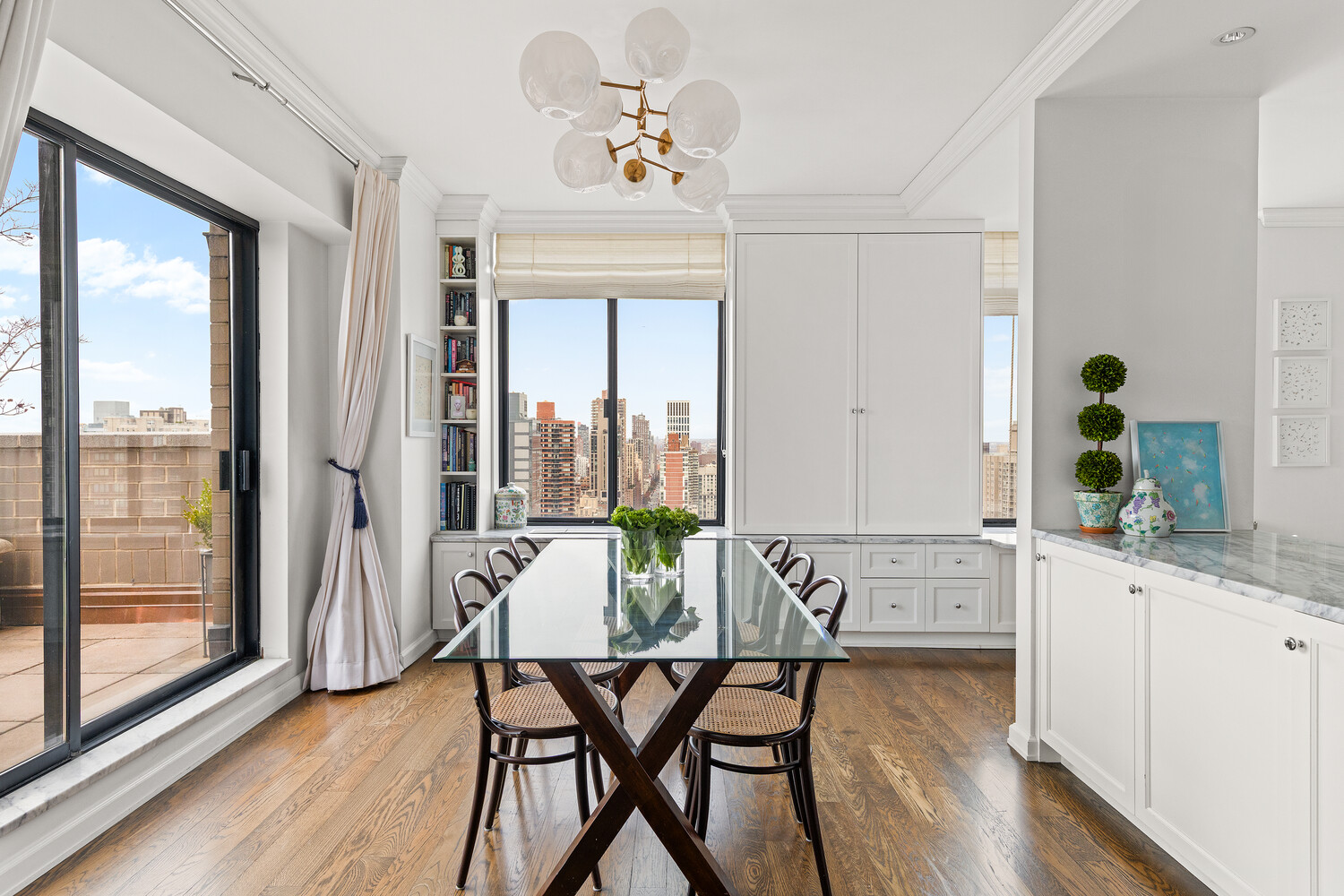 400 East 70th Street, Unit 3602 Manhattan, NY 10021 - Photo 15 of 20 a view of a dining room with furniture window and wooden floor
