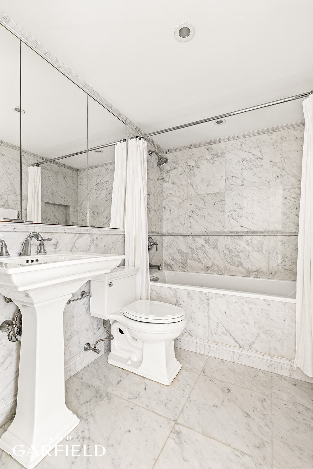 400 East 70th Street, Unit 3602 Manhattan, NY 10021 - Photo 15 of 21 a bathroom with a sink toilet and shower