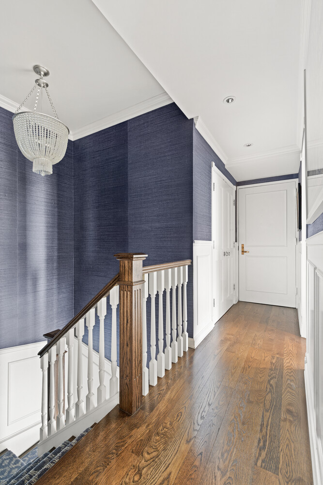 400 East 70th Street, Unit 3602 Manhattan, NY 10021 - Photo 6 of 20 a view of a hallway with wooden floor