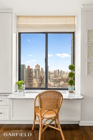 a view of a swimming pool with a lounge chair