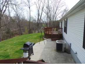 295 Tweed Road Limestone, TN 37681 - Photo 19 of 24 Backyard Side View