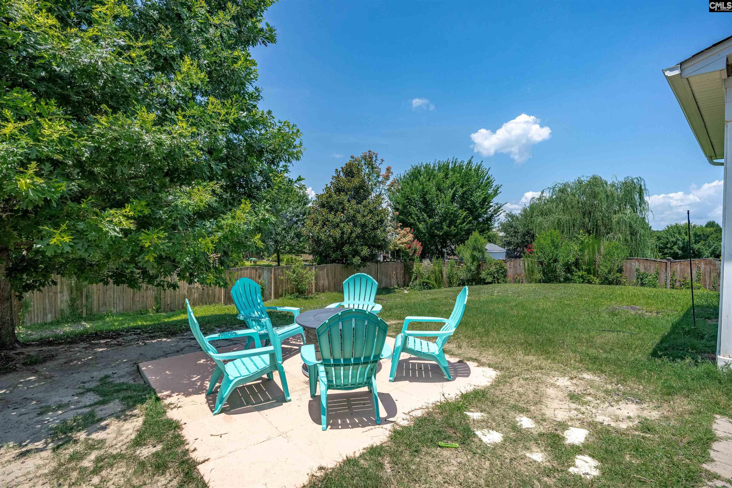 321 Asa Rose Lexington, SC 29072 - Photo 43 of 52 a view of a chair and table in backyard