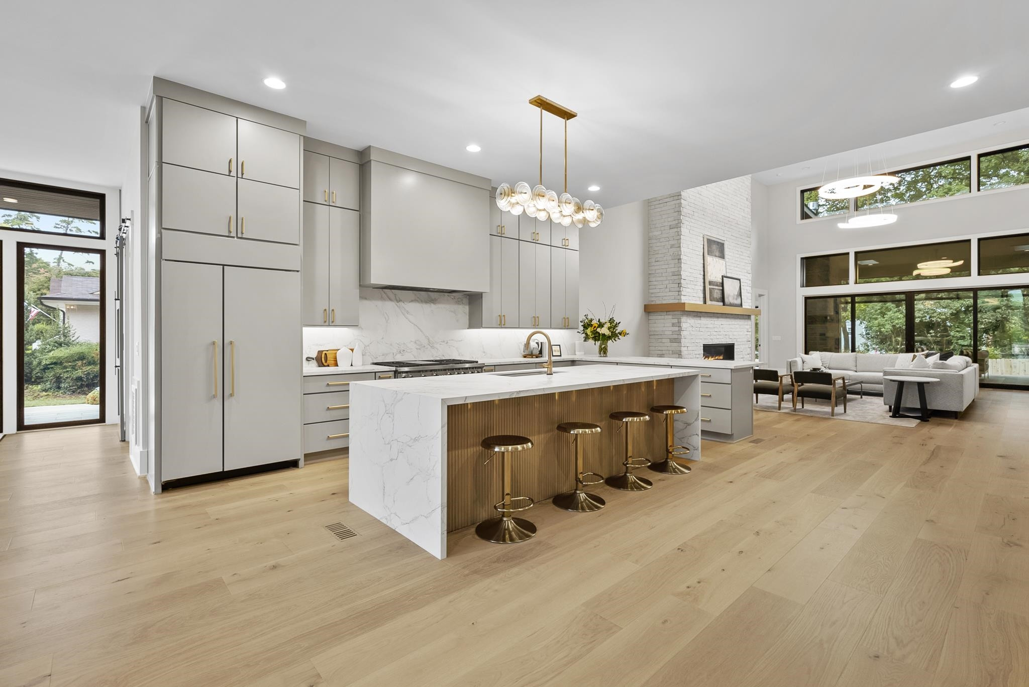 2116 Ridge Road Raleigh, NC 27607 - Photo 11 of 22 a kitchen with stainless steel appliances a sink a stove a refrigerator cabinets and living room view