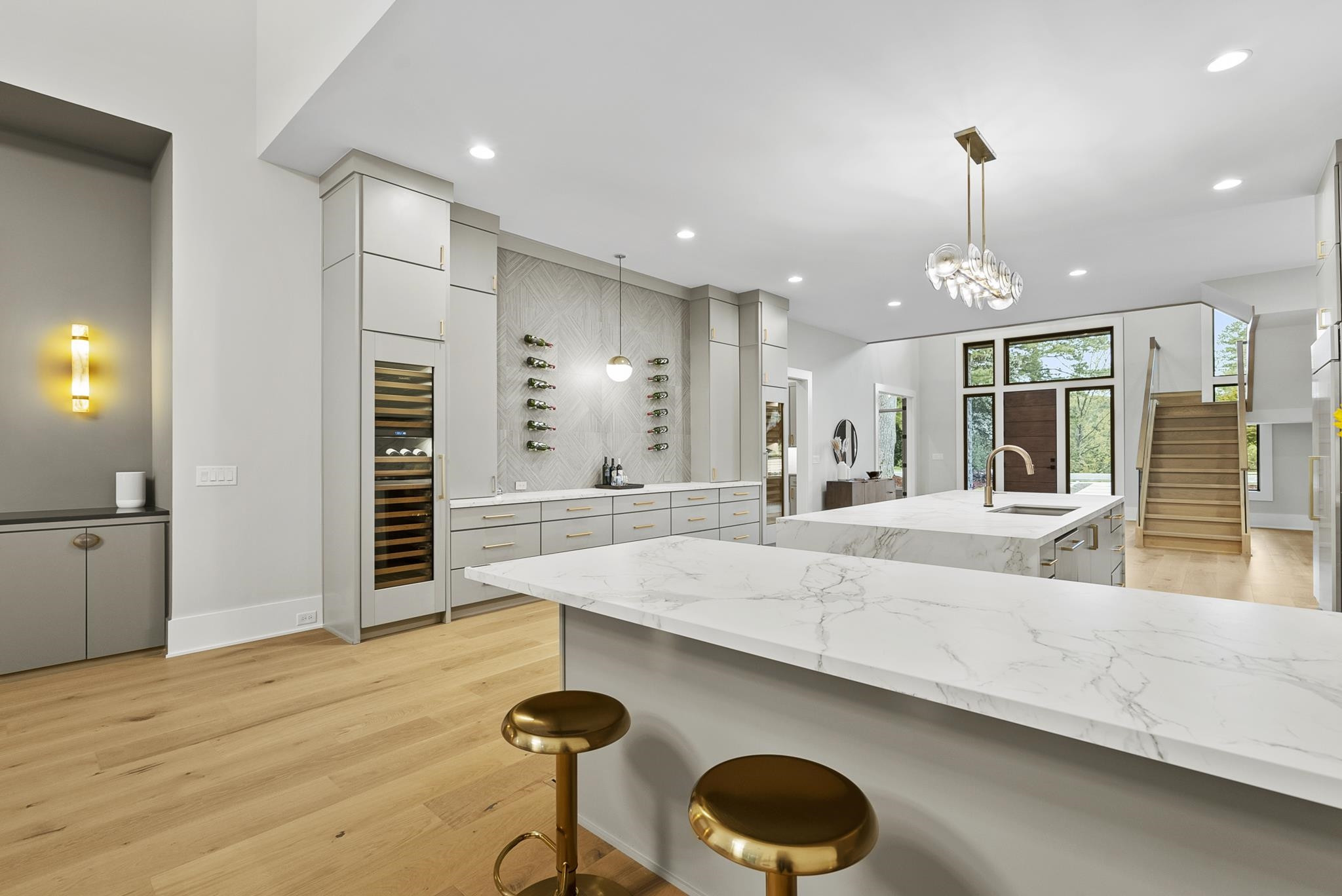 2116 Ridge Road Raleigh, NC 27607 - Photo 15 of 22 a large kitchen with kitchen island a stove a sink a center island and wooden floor