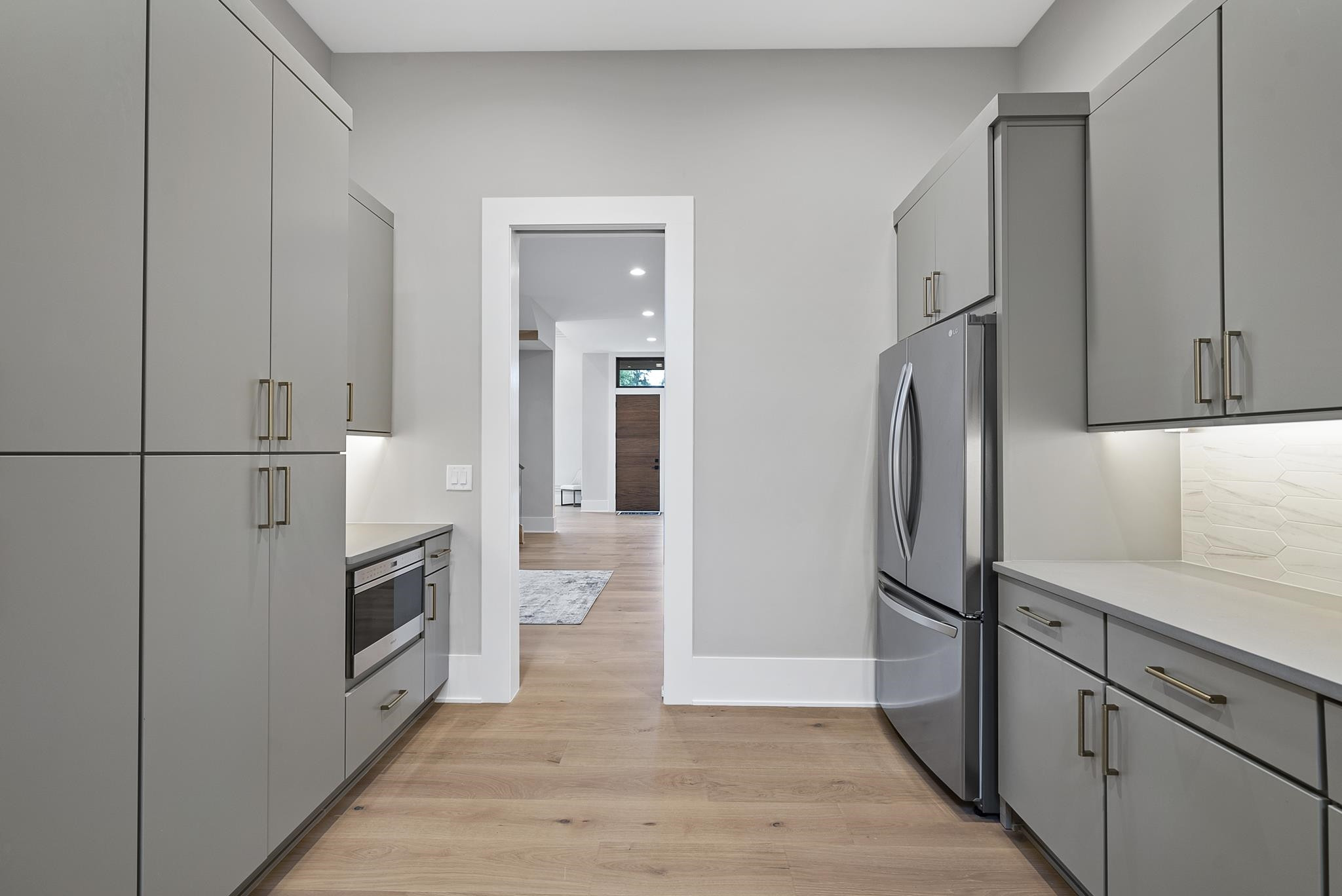 2116 Ridge Road Raleigh, NC 27607 - Photo 18 of 22 a kitchen with cabinets and stainless steel appliances