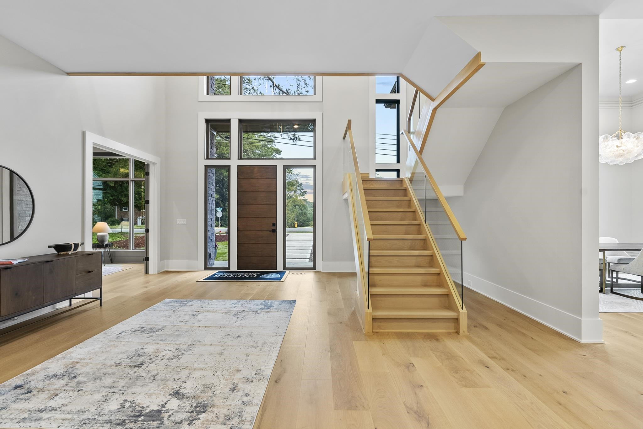 2116 Ridge Road Raleigh, NC 27607 - Photo 4 of 22 a view of a entryway door with wooden floor and a rug