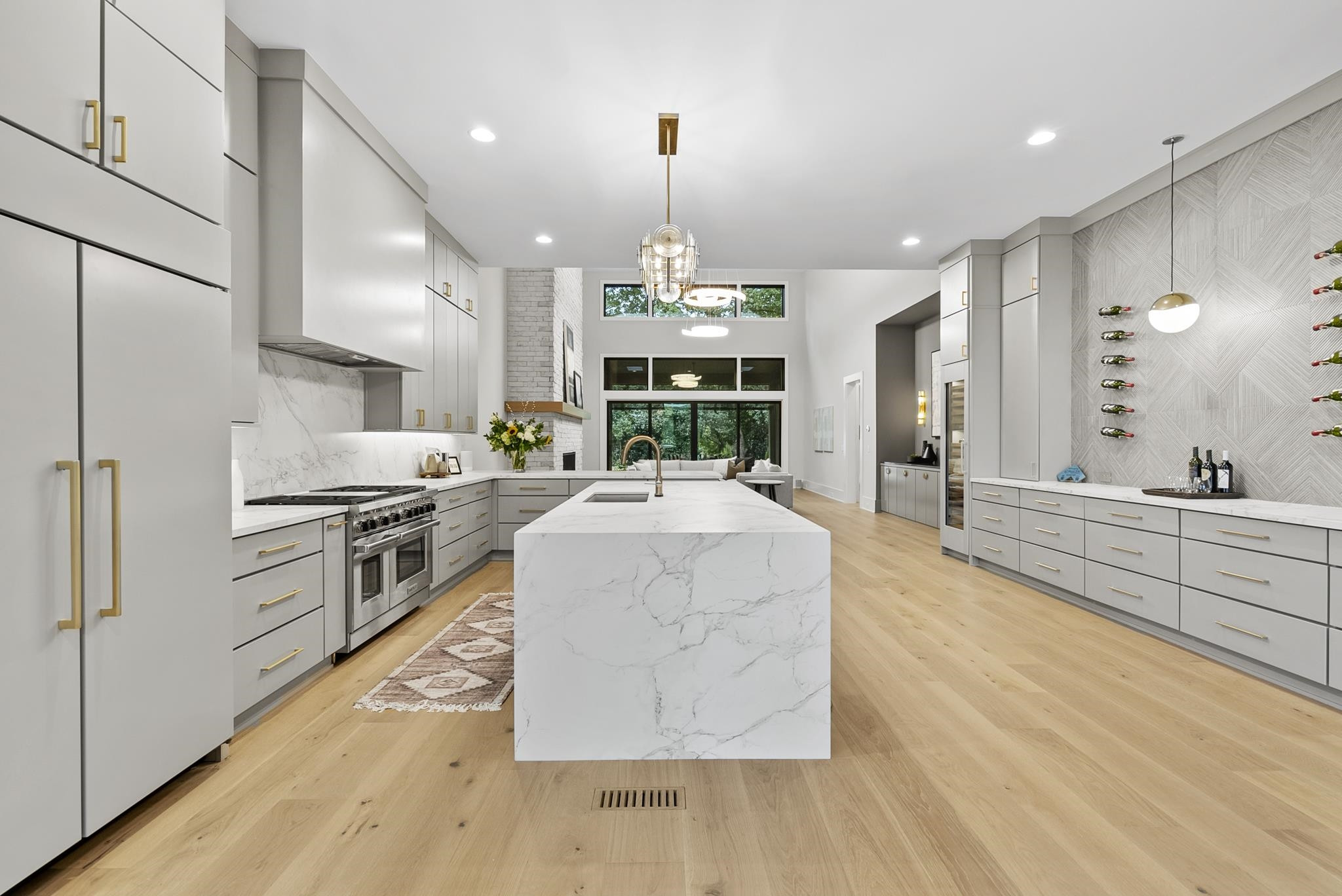 2116 Ridge Road Raleigh, NC 27607 - Photo 10 of 22 a large kitchen with stainless steel appliances granite countertop a large center island attached withe living room