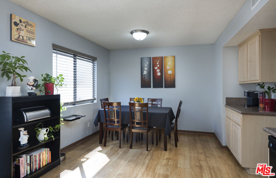 19355 Sherman Way, Unit 37 Reseda, CA 91335 - Photo 6 of 12 a view of a dining room with furniture and window
