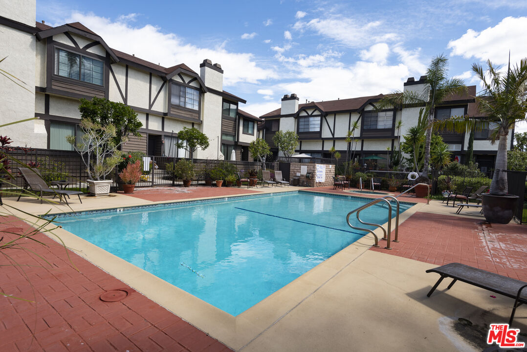 19355 Sherman Way, Unit 37 Reseda, CA 91335 - Photo 9 of 12 a swimming pool with outdoor seating and yard