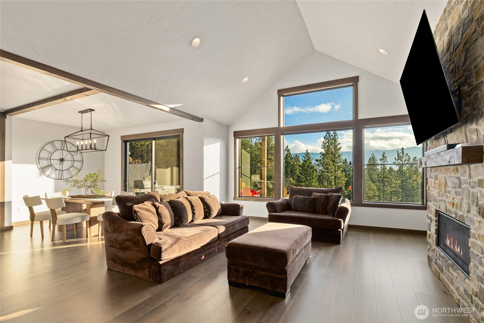 120 Owl Ridge Drive Cle Elum, WA 98922 - Photo 12 of 34 a living room with fireplace furniture and a large window