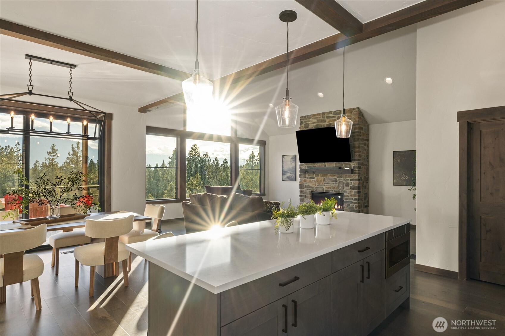 120 Owl Ridge Drive Cle Elum, WA 98922 - Photo 16 of 34 a kitchen with stainless steel appliances kitchen island granite countertop a sink a stove and a refrigerator