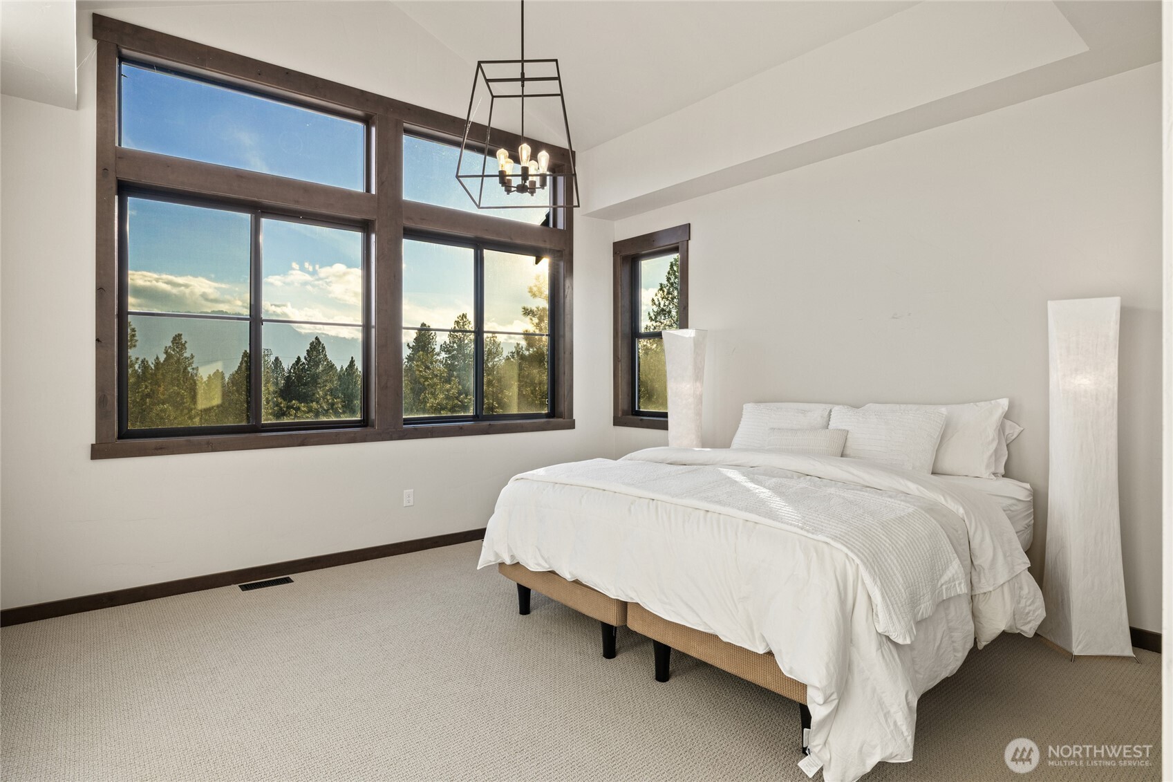 120 Owl Ridge Drive Cle Elum, WA 98922 - Photo 17 of 34 a bed sitting in a bedroom next to a window