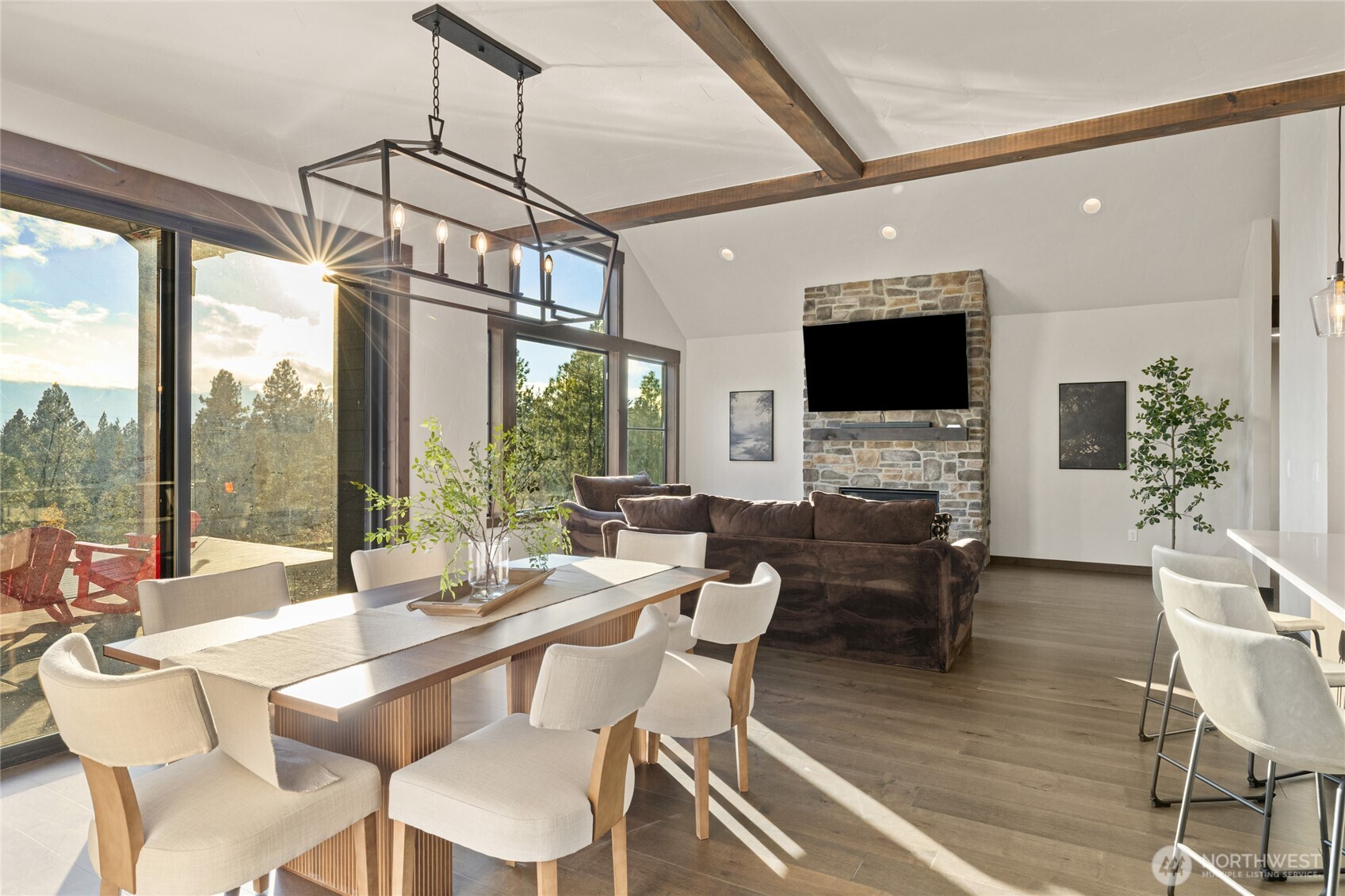 120 Owl Ridge Drive Cle Elum, WA 98922 - Photo 5 of 34 a dining room with furniture a chandelier and wooden floor