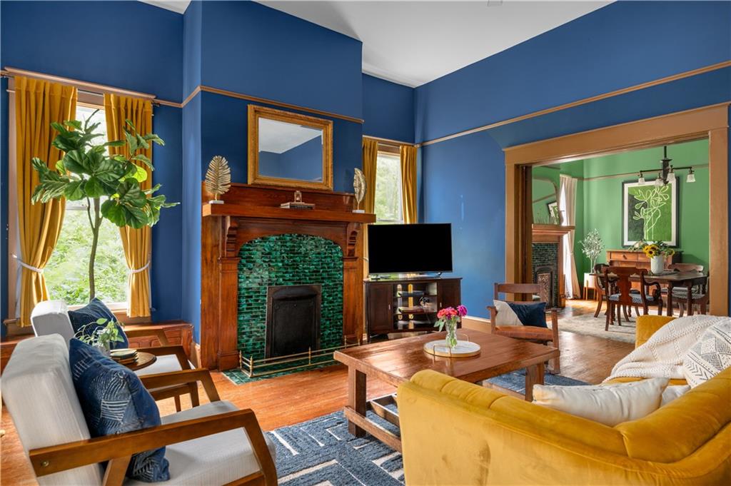 70 Kirkwood Road Northeast, Unit MH Atlanta, GA 30317 - Photo 1 of 36 a living room with fireplace furniture and a flat screen tv