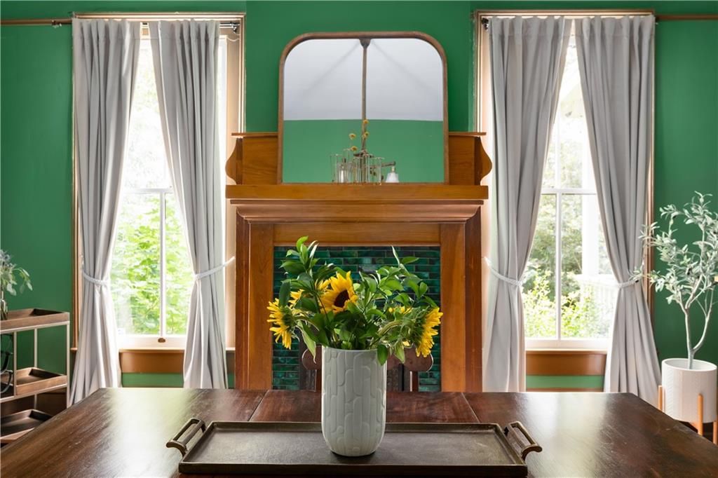 70 Kirkwood Road Northeast, Unit MH Atlanta, GA 30317 - Photo 13 of 36 a vase of flowers sitting next to a window