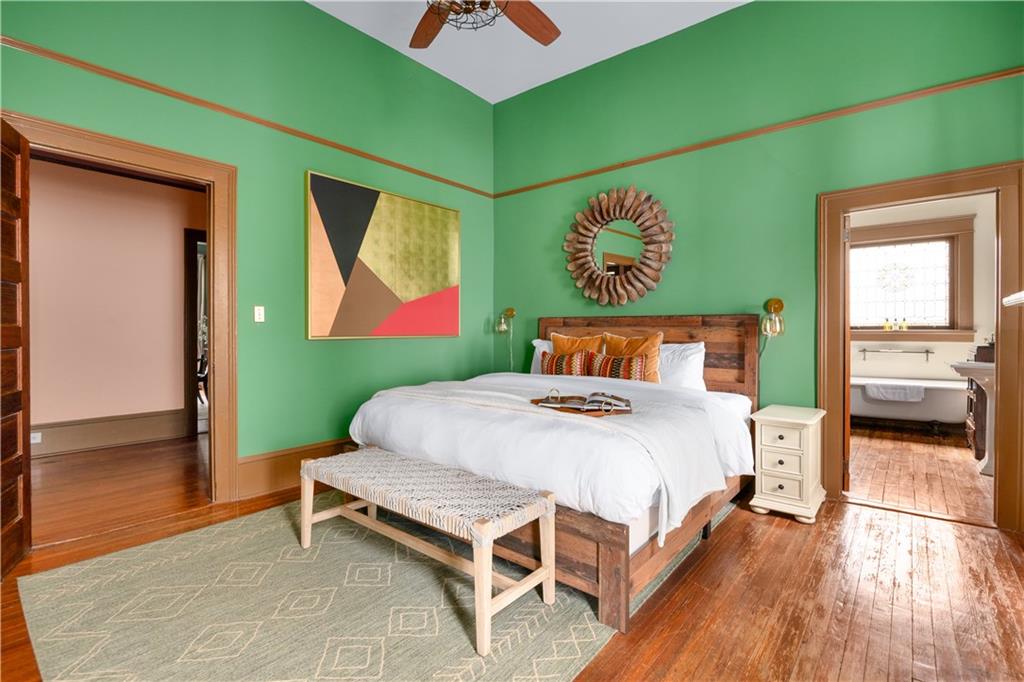 70 Kirkwood Road Northeast, Unit MH Atlanta, GA 30317 - Photo 19 of 36 a bedroom with a bed and a painting on the wall