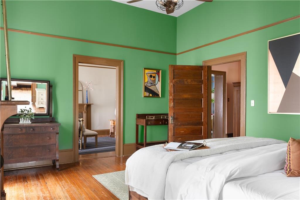 70 Kirkwood Road Northeast, Unit MH Atlanta, GA 30317 - Photo 21 of 36 a bedroom with a bed and a dresser