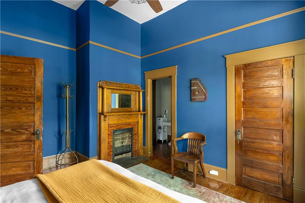 70 Kirkwood Road Northeast, Unit MH Atlanta, GA 30317 - Photo 25 of 36 a bedroom with a chair and large windows