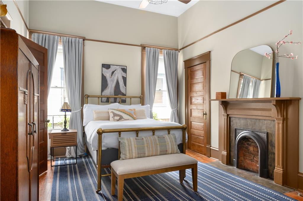 70 Kirkwood Road Northeast, Unit MH Atlanta, GA 30317 - Photo 28 of 36 a bedroom with furniture and a fireplace