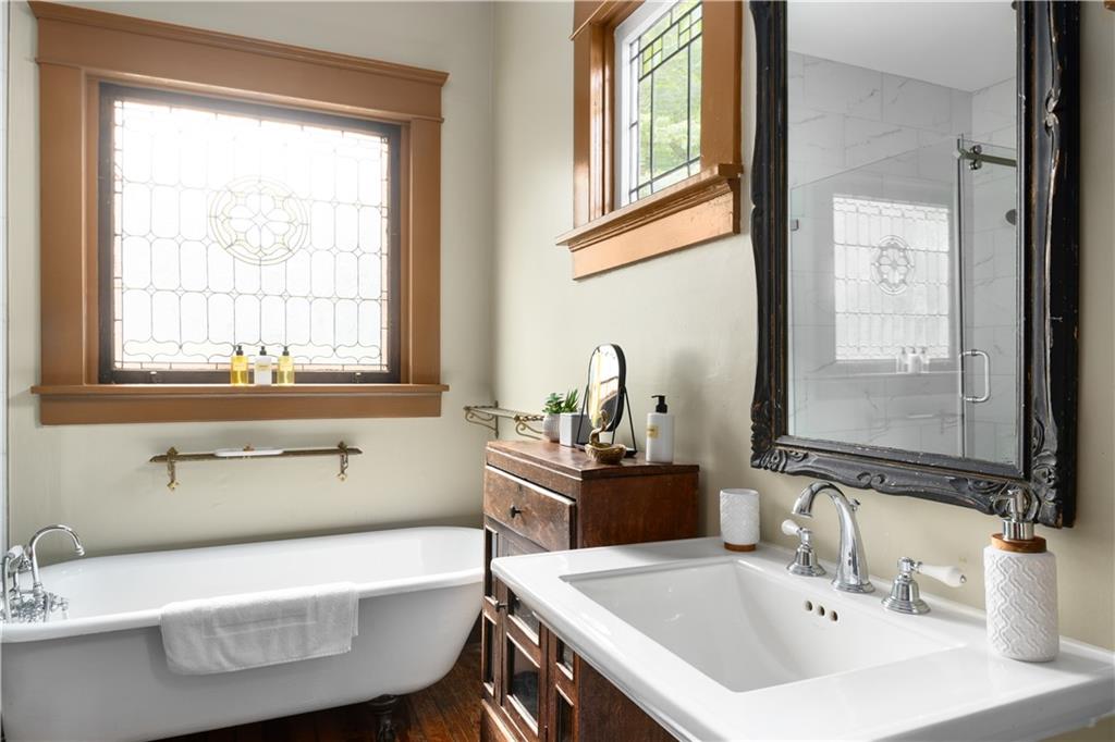 70 Kirkwood Road Northeast, Unit MH Atlanta, GA 30317 - Photo 30 of 36 a bathroom with a sink and a bathtub