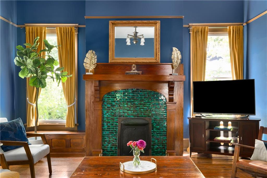 70 Kirkwood Road Northeast, Unit MH Atlanta, GA 30317 - Photo 6 of 36 a living room with fireplace furniture and a flat screen tv