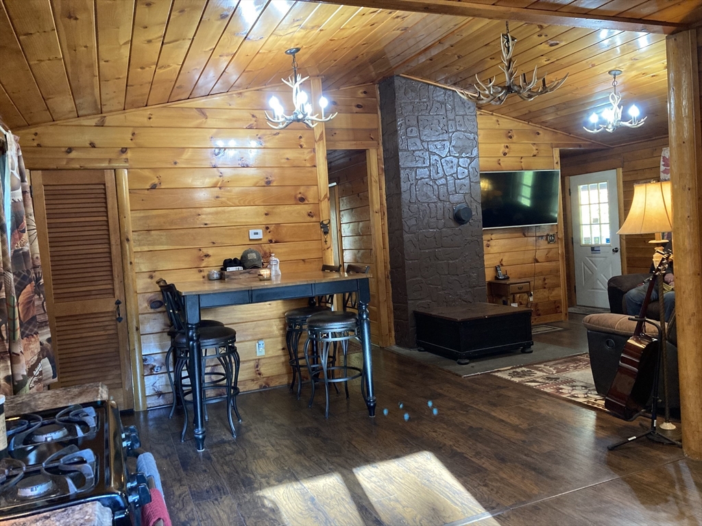 769 N Road Hardwick, MA 01037 - Photo 11 of 25 a view of a patio with dining table and chairs