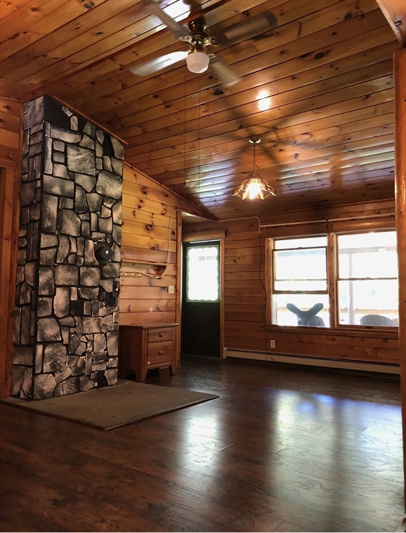 769 N Road Hardwick, MA 01037 - Photo 13 of 25 wooden floor in an empty room with a window