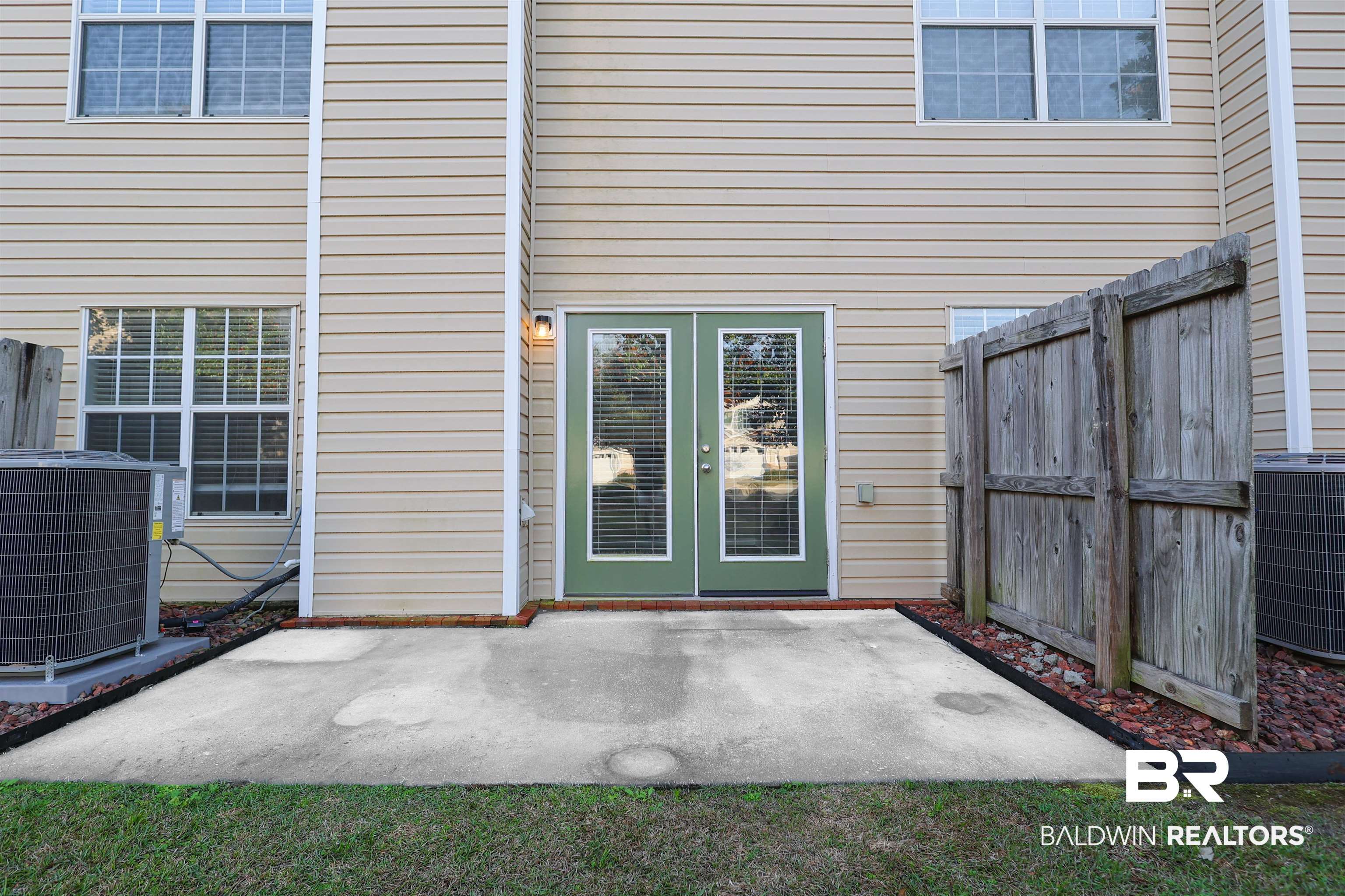 1517 Regency Road, Unit 125 Gulf Shores, AL 36542 - Photo 23 of 26 Property entrance featuring a patio