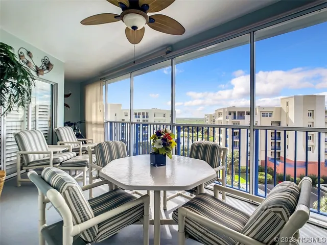 a view of a dining room with furniture window and outside view
