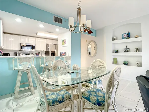 a dining room with furniture and a clock