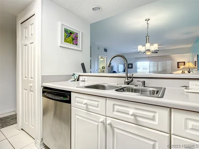 a kitchen with a sink and a stove